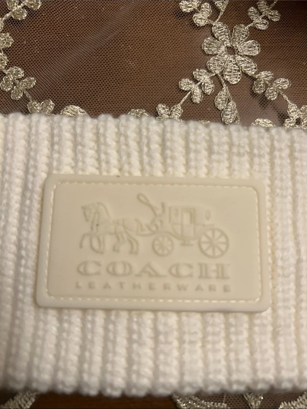 Coach Cream Ribbed Knit Beanie with Embossed Leatherware Patch. Like new.